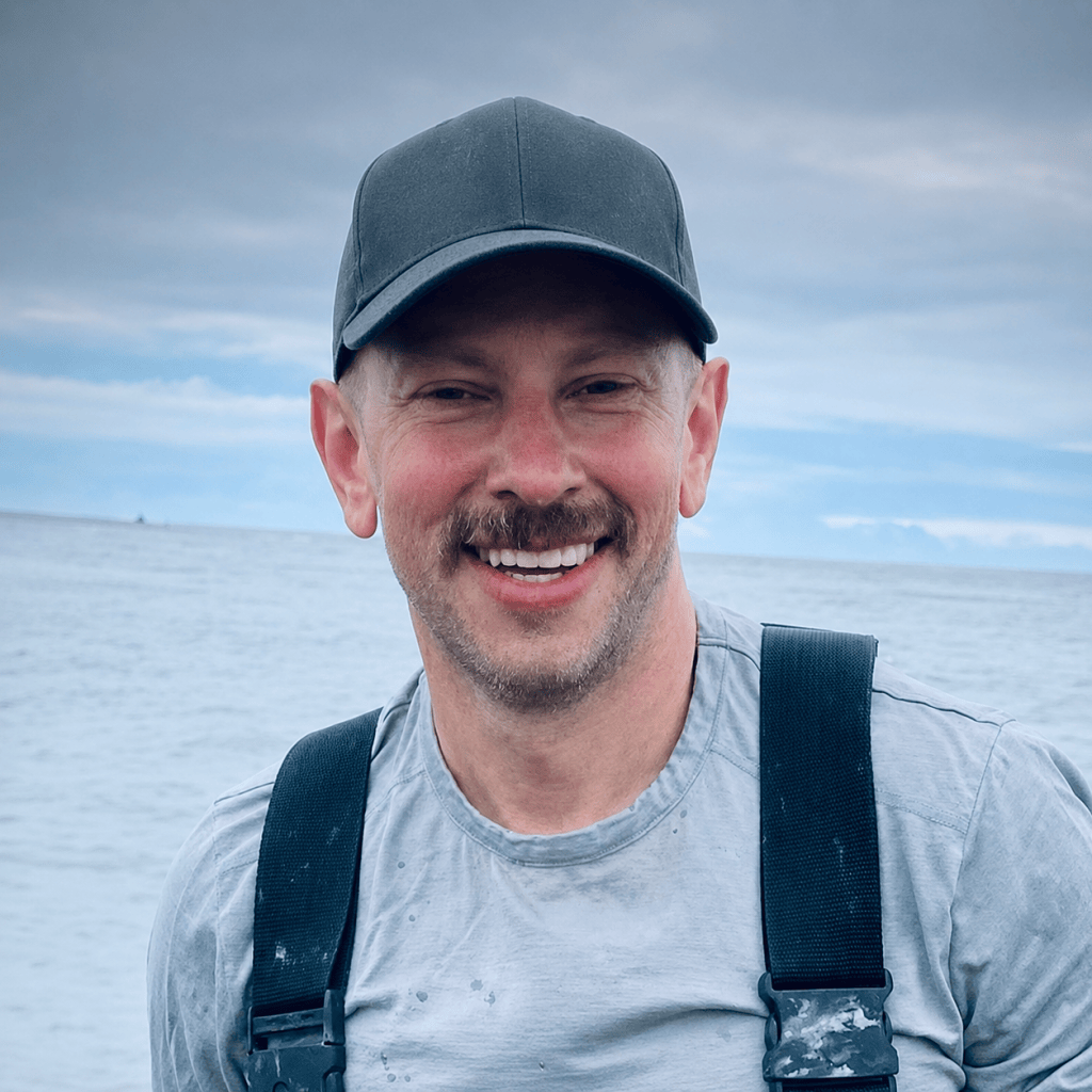 Jacob Bera, Eagle River educator, standing by the water