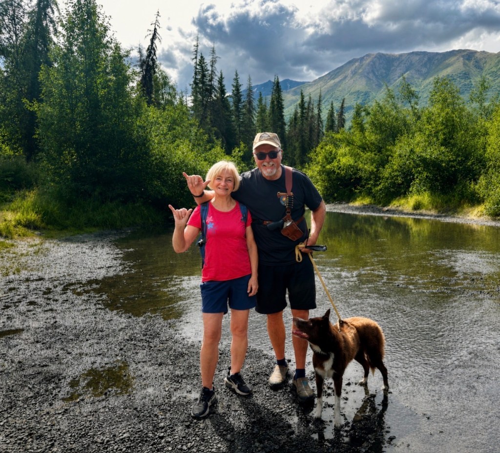 Kelly and Marti Ward with their dog on a hike near Eagle River